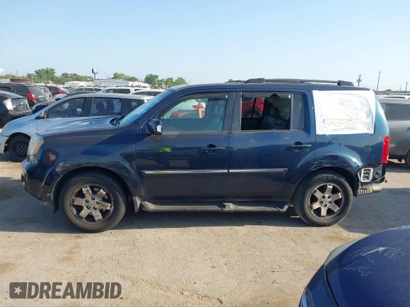 2011 Honda Pilot Touring with VIN 5FNYF4H92BB090056, listed as a IAAI auction lot 42010682 with 201,640 mi miles. Bid and sale history available at carsss.com. Image 14.