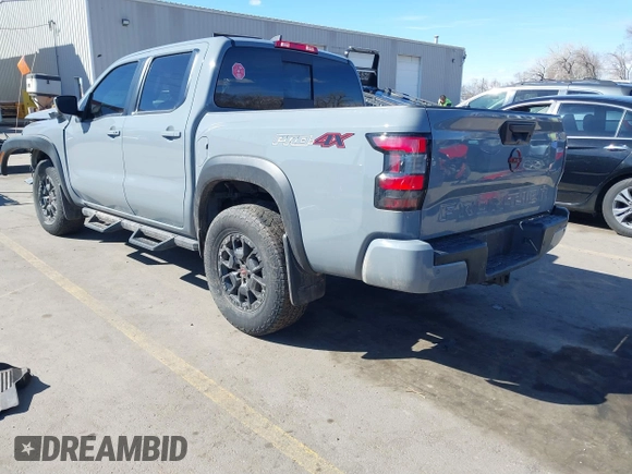 2023 Nissan Frontier SV with VIN 1N6ED1EK2PN633278, listed as a IAAI auction lot 41854671 with 59,549 mi miles and . Bid and sale history available at DreamBid. Image 3.