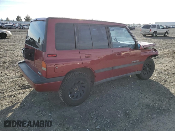 1995 Suzuki Sidekick z VIN JS3TD03V6S4113425, wystawiony jako Copart lot #76973244 z przebiegiem 152 638 mil mil oraz Szkody całkowita. Historia ofert i sprzedaży dostępna na DreamBid. Obrazek 3.