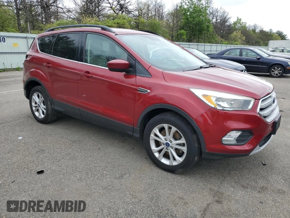 2018 Ford Escape SE z VIN 1FMCU9GD7JUB01668, wystawiony jako Copart lot #57038675 z przebiegiem 70 780 mil mil oraz Szkoda całkowita • Salvage title. Historia ofert i sprzedaży dostępna na DreamBid. Obrazek 4.
