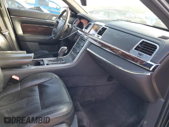 2012 Lincoln MKS с VIN 1LNHL9ER6CG804784, выставлен на аукционе Copart как лот 89372635 с пробегом 173 533 миль миль и Списание • Salvage title. История ставок и продаж доступна на DreamBid. Изображение 7.