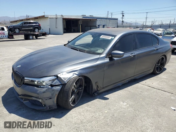 2018 BMW 7 Series 740i with VIN WBA7E2C59JG742809, listed as a Copart auction lot 66995934 with 62,017 mi miles and Salvage Title. Bid and sale history available at carsss.com. Image 1.