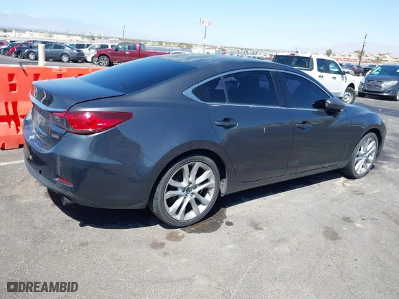 2014 Mazda Mazda6 i Touring with VIN JM1GJ1V52E1104111, listed as a IAAI auction lot 42008695 with 241,149 mi miles. Bid and sale history available at carsss.com. Image 4.