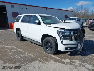 2020 Chevrolet Tahoe Commercial with VIN 1GNSKDEC2LR217697, listed as a IAAI auction lot 40815499 with 128,503 mi miles. Bid and sale history available at carsss.com. Image 1.