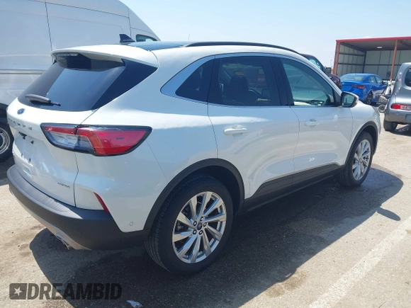 2021 Ford Escape Titanium with VIN 1FMCU9J91MUA29407, listed as a IAAI auction lot 42120442 with 19,314 mi miles and . Bid and sale history available at DreamBid. Image 4.