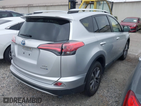 2016 Toyota RAV4 Hybrid XLE with VIN JTMRJREVXGD029019, listed as a IAAI auction lot 42021530 with 74,400 mi miles. Bid and sale history available at carsss.com. Image 4.