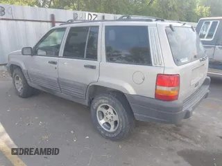 1998 Jeep Grand Cherokee Laredo with VIN 1J4GZ58S6WC319265, listed as a IAAI auction lot 42619853 with 238,667 mi miles and . Bid and sale history available at DreamBid. Image 3.