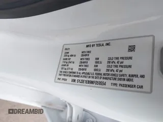 2021 Tesla Model 3 Long Range with VIN 5YJ3E1EB9MF059554, listed as a IAAI auction lot 41231520 with 63,696 mi miles and . Bid and sale history available at DreamBid. Image 9.
