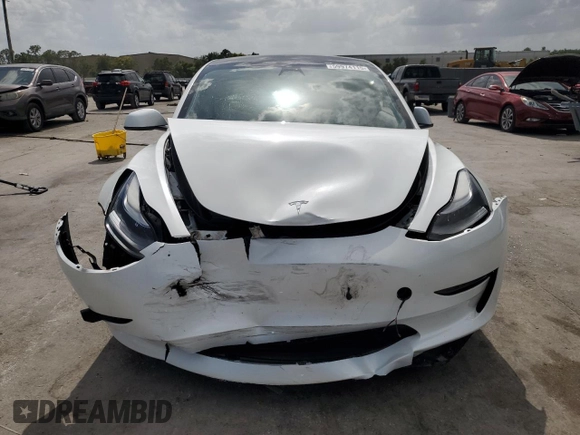 2023 Tesla Model 3 with VIN 5YJ3E1EA8PF499535, listed as a Copart auction lot 59974115 with 18,365 mi miles and Salvage title. Bid and sale history available at DreamBid. Image 5.