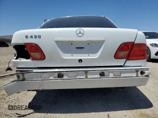 1999 Mercedes-Benz E-Class with VIN WDBJF70H5XA831773, listed as a Copart auction lot 71320244 with 145,181 mi miles and Salvage Title. Bid and sale history available at carsss.com. Image 6.