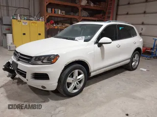 2011 Volkswagen Touareg Sport with VIN WVGFF9BP8BD004747, listed as a IAAI auction lot 41780515 with 159,228 mi miles and . Bid and sale history available at DreamBid. Image 17.
