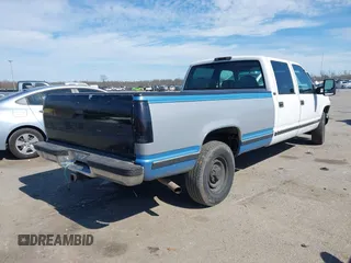 1996 GMC Sierra 1500 with VIN 1GTGC33R4TF018147, listed as a IAAI auction lot 41612770 with 106,443 mi miles and . Bid and sale history available at DreamBid. Image 4.