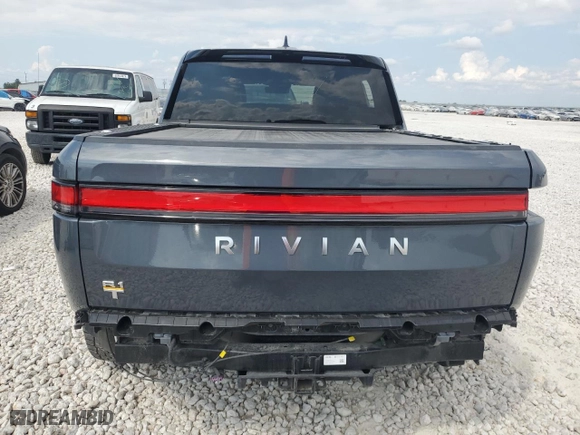 2022 Rivian R1T Launch Edition with VIN 7FCTGAAL1NN003050, listed as a Copart auction lot 68101044 with 21,392 mi miles and Salvage Title. Bid and sale history available at carsss.com. Image 6.
