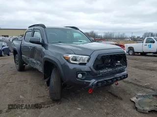 2021 Toyota Tacoma 4WD SR with VIN 3TMCZ5AN2MM406293, listed as a IAAI auction lot 41925585 with 52,243 mi miles. Bid and sale history available at carsss.com. Image 1.