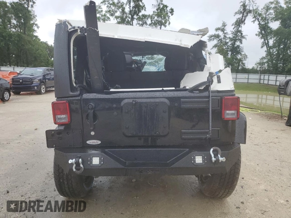 2014 Jeep Wrangler Unlimited Sahara z VIN 1C4HJWEG4EL305998, wystawiony jako Copart lot #56377275 z przebiegiem 60 597 mil mil oraz Szkoda całkowita • Salvage title. Historia ofert i sprzedaży dostępna na DreamBid. Obrazek 6.