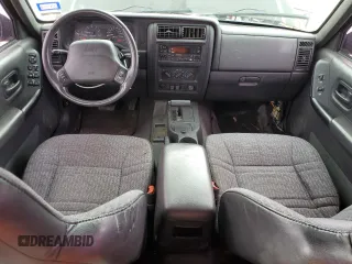 2000 Jeep Cherokee with VIN 1J4FT48S3YL139915, listed as a Copart auction lot 69840924 with 249,720 mi miles and Salvage title. Bid and sale history available at DreamBid. Image 8.