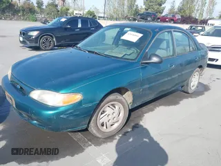 1997 Ford Escort LX with VIN 1FALP13P3VW125396, listed as a IAAI auction lot 42036066 with 132,239 mi miles. Bid and sale history available at carsss.com. Image 2.