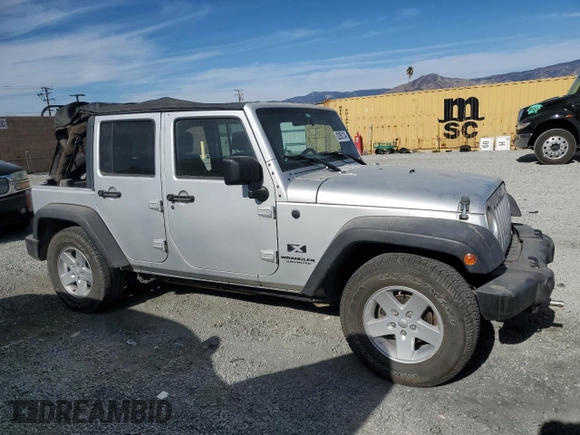 2007 Jeep Wrangler Unlimited X with VIN 1J8GB39157L142982, listed as a Copart auction lot 82050134 with 72,666 mi miles and Salvage Title. Bid and sale history available at DreamBid. Image 4.