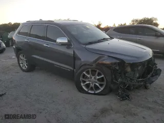2014 Jeep Grand Cherokee Summit with VIN 1C4RJFJT0EC371942, listed as a Copart auction lot 84918334 with 207,797 mi miles and Salvage Title. Bid and sale history available at carsss.com. Image 4.