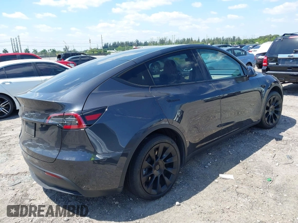 2024 Tesla Model Y with VIN 7SAYGDED3RF019063, listed as a IAAI auction lot 42061888 with 13,763 mi miles and . Bid and sale history available at DreamBid. Image 4.