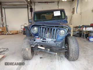 2003 Jeep Wrangler Sport with VIN 1J4FA49S53P311822, listed as a IAAI auction lot 41621710 with 156,023 mi miles. Bid and sale history available at carsss.com. Image 12.