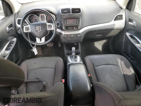 2013 Dodge Journey American Value with VIN 3C4PDCAB6DT709996, listed as a Copart auction lot 52362635 with 104,808 mi miles and Salvage Title. Bid and sale history available at DreamBid. Image 8.