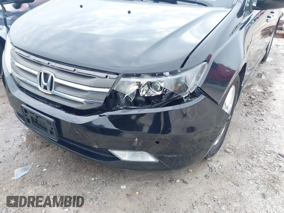 2012 Honda Odyssey Touring with VIN 5FNRL5H96CB058828, listed as a IAAI auction lot 41731389 with 152,295 mi miles and . Bid and sale history available at DreamBid. Image 6.