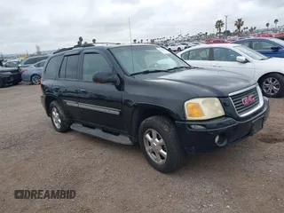 2003 GMC Envoy SLT with VIN 1GKDS13S232298062, listed as a IAAI auction lot 41668380 with 195,045 mi miles. Bid and sale history available at carsss.com. Image 1.