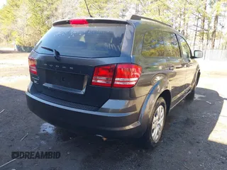 2016 Dodge Journey SE with VIN 3C4PDCAB6GT104588, listed as a IAAI auction lot 41823732 with 133,819 mi miles. Bid and sale history available at carsss.com. Image 4.