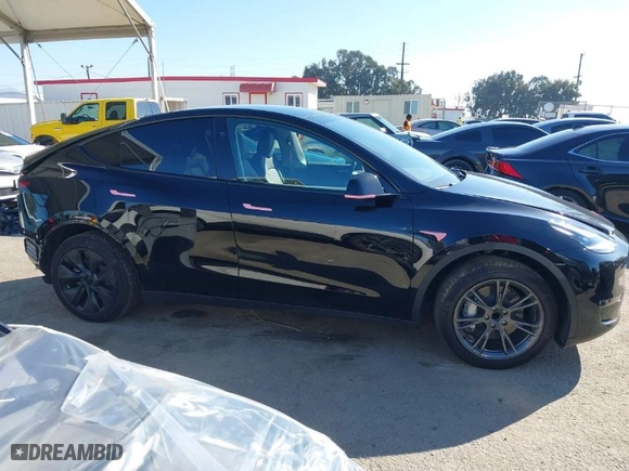 2024 Tesla Model Y with VIN 7SAYGDED1RF212991, listed as a IAAI auction lot 41644411 with NaN miles. Bid and sale history available at carsss.com. Image 14.