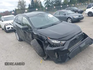 2019 Toyota RAV4 LE with VIN JTMF1RFV4KD030550, listed as a IAAI auction lot 40596628 with 92,318 mi miles and . Bid and sale history available at DreamBid. Image 1.