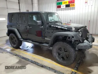 2009 Jeep Wrangler Unlimited Rubicon with VIN 1J8GA69179L756441, listed as a Copart auction lot 52111435 with 157,818 mi miles and Salvage title. Bid and sale history available at DreamBid. Image 4.