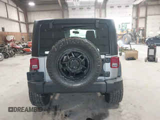 2014 Jeep Wrangler Sport with VIN 1C4AJWAG0EL173362, listed as a IAAI auction lot 42231863 with 99,321 mi miles and . Bid and sale history available at DreamBid. Image 16.