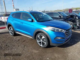 2018 Hyundai Tucson Sport z VIN KM8J33AL1JU693916, wystawiony jako IAAI lot #42072745 z przebiegiem 96 576 mil mil oraz . Historia ofert i sprzedaży dostępna na DreamBid. Obrazek 1.