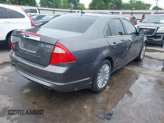 2012 Ford Fusion Hybrid z VIN 3FADP0L33CR289548, wystawiony jako IAAI lot #41905806 z przebiegiem 121 233 mil mil oraz . Historia ofert i sprzedaży dostępna na DreamBid. Obrazek 4.