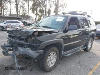 2004 Chevrolet Tahoe LS with VIN 1GNEK13T64R265302, listed as a IAAI auction lot 41445237 with 242,840 mi miles. Bid and sale history available at carsss.com. Image 17.