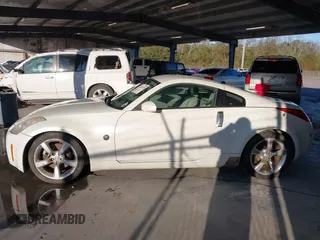 2006 Nissan 350Z Touring z VIN JN1AZ34D86M307042, wystawiony jako IAAI lot #41016528 z przebiegiem 124 303 mil mil oraz . Historia ofert i sprzedaży dostępna na DreamBid. Obrazek 14.