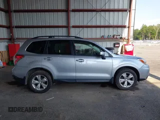 2014 Subaru Forester Premium z VIN JF2SJADC8EH541081, wystawiony jako IAAI lot #42647777 z przebiegiem 120 951 mil mil oraz . Historia ofert i sprzedaży dostępna na DreamBid. Obrazek 13.