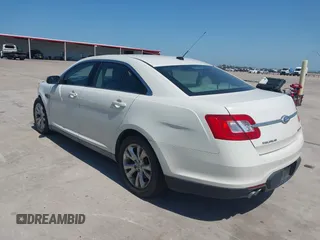 2011 Ford Taurus SEL z VIN 1FAHP2HW7BG148004, wystawiony jako IAAI lot #42245047 z przebiegiem 102 999 mil mil oraz . Historia ofert i sprzedaży dostępna na DreamBid. Obrazek 3.