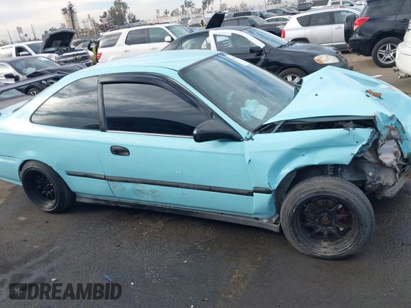 1998 Honda Civic HX with VIN 1HGEJ7127WL127977, listed as a IAAI auction lot 41230187 with 182,000 mi miles. Bid and sale history available at carsss.com. Image 14.