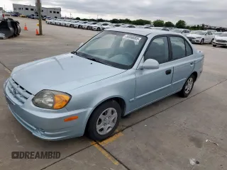 2003 Hyundai Accent GL z VIN KMHCG45C73U481294, wystawiony jako Copart lot #55958005 z przebiegiem 136 964 mil mil oraz Czysty tytuł • Clean title. Historia ofert i sprzedaży dostępna na DreamBid. Obrazek 1.