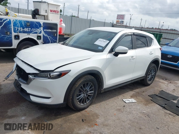 2020 Mazda CX-5 Touring z VIN JM3KFBCM2L0786784, wystawiony jako IAAI lot #42127457 z przebiegiem 62 665 mil mil oraz . Historia ofert i sprzedaży dostępna na DreamBid. Obrazek 17.