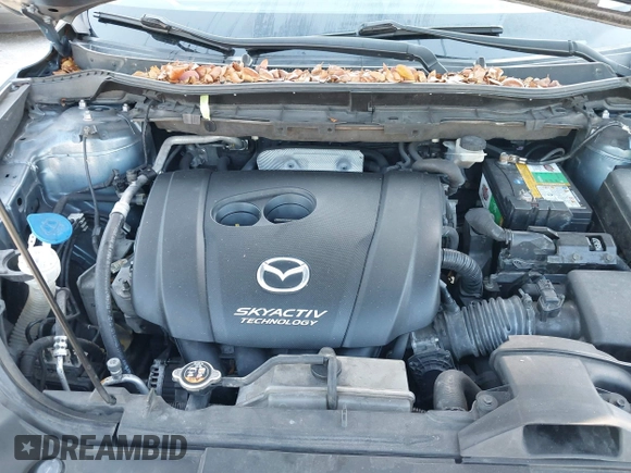 2016 Mazda CX-5 Sport with VIN JM3KE2BY8G0864983, listed as a IAAI auction lot 42072385 with 141,104 mi miles. Bid and sale history available at carsss.com. Image 10.