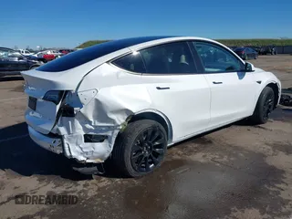 2023 Tesla Model Y Long Range with VIN 7SAYGDEE0PF945202, listed as a IAAI auction lot 41611762 with 7,316 mi miles and . Bid and sale history available at DreamBid. Image 4.