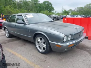 2002 Jaguar XJ with VIN SAJDA12CX2LF49531, listed as a IAAI auction lot 42124743 with 120,486 mi miles. Bid and sale history available at carsss.com. Image 1.