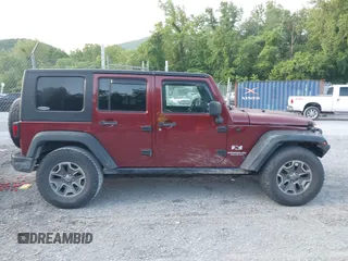 2008 Jeep Wrangler Unlimited X z VIN 1J4GA39128L568988, wystawiony jako IAAI lot #42445403 z przebiegiem 198 032 mil mil oraz . Historia ofert i sprzedaży dostępna na DreamBid. Obrazek 13.