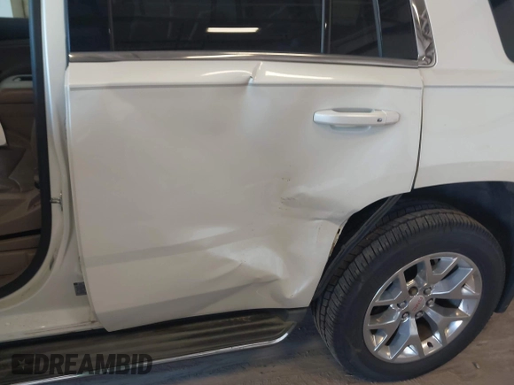 2015 GMC Yukon SLT z VIN 1GKS2BKC8FR109563, wystawiony jako IAAI lot #42194070 z przebiegiem 203 619 mil mil oraz . Historia ofert i sprzedaży dostępna na DreamBid. Obrazek 6.