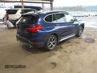 2019 BMW X1 xDrive28i with VIN WBXHT3C55K5L37338, listed as a IAAI auction lot 41934461 with 87,913 mi miles. Bid and sale history available at carsss.com. Image 4.