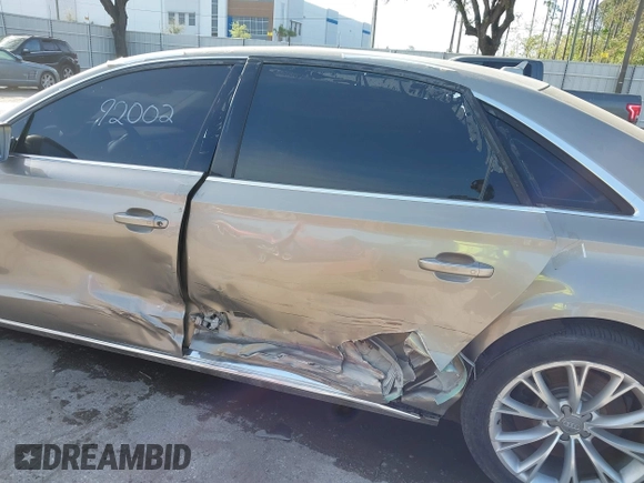 2012 Audi A8 z VIN WAURVAFD3CN024063, wystawiony jako IAAI lot #41706508 z przebiegiem Nie podano mil oraz . Historia ofert i sprzedaży dostępna na DreamBid. Obrazek 6.