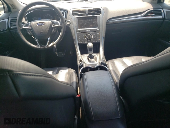 2014 Ford Fusion Titanium с VIN 3FA6P0K90ER363283, выставлен на аукционе Copart как лот 55156795 с пробегом 54 099 миль миль и Списание • Salvage title. История ставок и продаж доступна на DreamBid. Изображение 8.